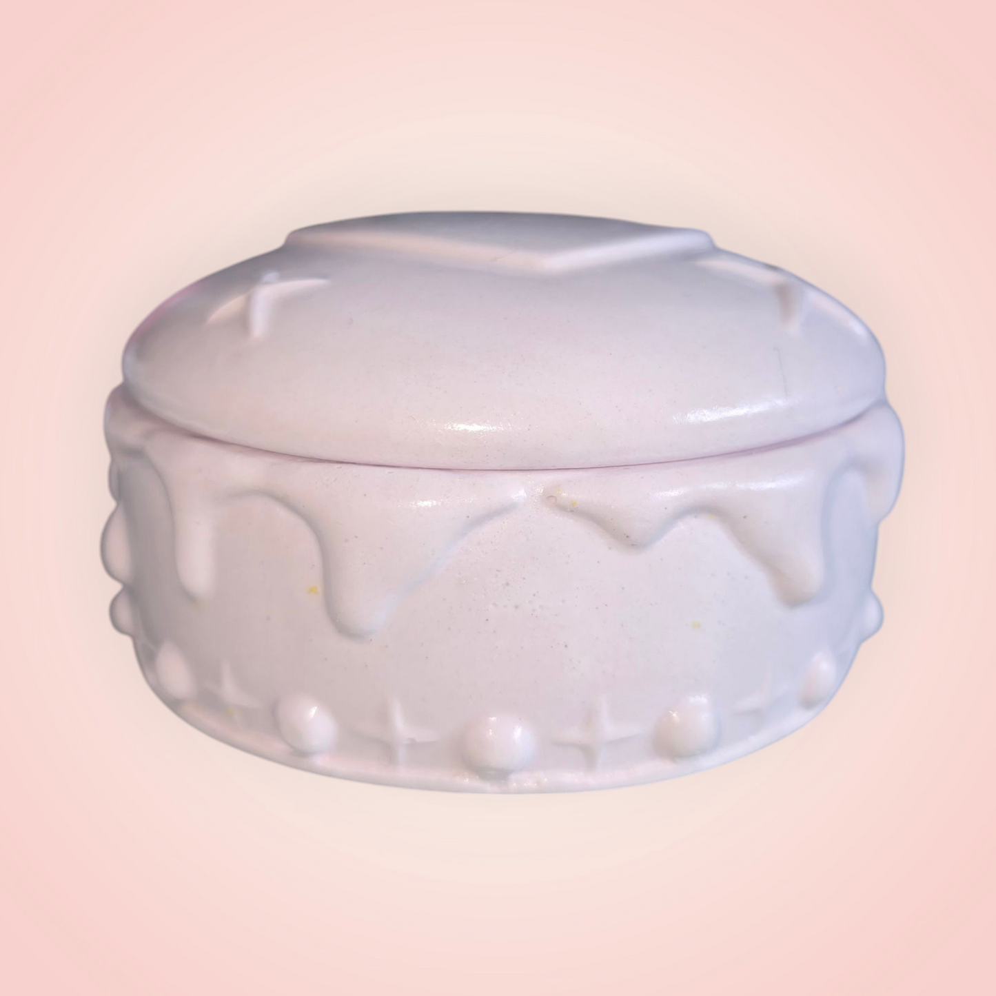 Soy Wax Candle in handmade white candle container with lid.