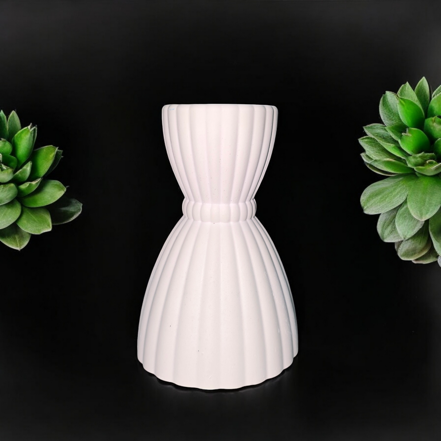 white ribbed candle holder for taper candles