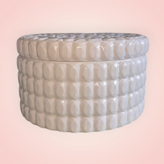 Round soy wax candle vessel with lid. 